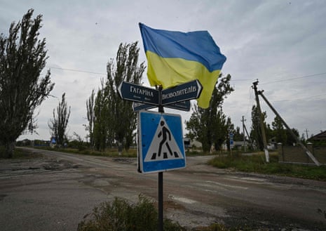 A Ukrainian flag waves on a street of the recently liberated village of Vysokopillya in the Kherson region