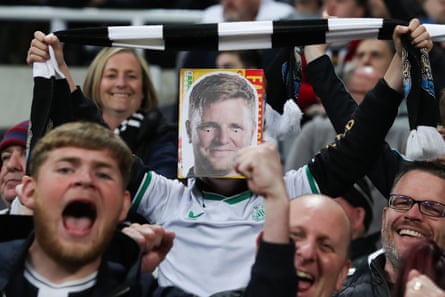 A young Newcastle United supporter wears a mask depicting the face of Eddie Howe, the club’s manager, during their 0-0 draw with Leicester City at St James’ Park. The point was enough to seal Newcastle’s place in the top four