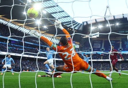 Erling Haaland scores Manchester City’s first goal past a despairing dive from Alphonse Areola