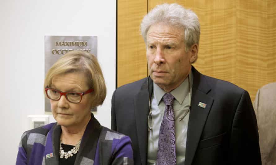 Andy Parker and his wife, Barbara, listen as then Virginia governor Terry McAulliffe announces a compromise on a set of gun bills at the Capitol in 2016.