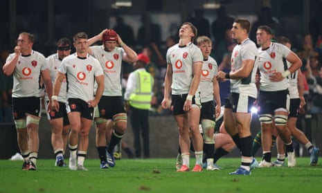 The Wales players react at full-time