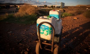 Water the farm workers at El Nazareno settlement drink, kept in toxic containers