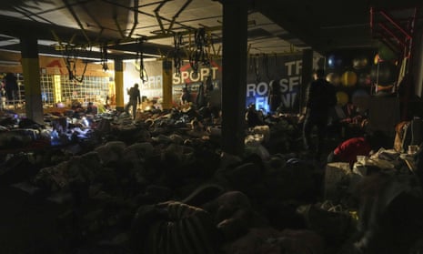 People prepare for the night in the improvised bomb shelter in a sports centre in Mariupol, Ukraine, 27 February 2022. 