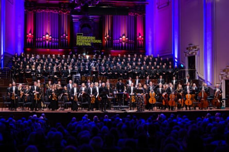 Applause at the Usher Hall for The Song of Hiawatha. All musicians on a broad stage, warmly lit, standing as they face the audience