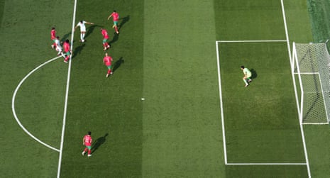 Kylian Mbappe celebrates scoring their first goal as Morocco's Yassine Bounou reacts