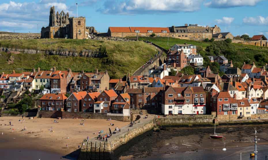 Whitby East Cliff with beach and Abbey.
