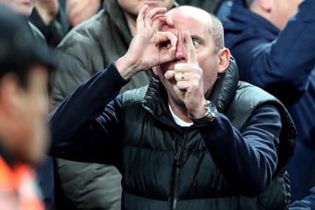 January 13: A Manchester United fan taunts the Tottenham fans by gesturing the scoreline.
