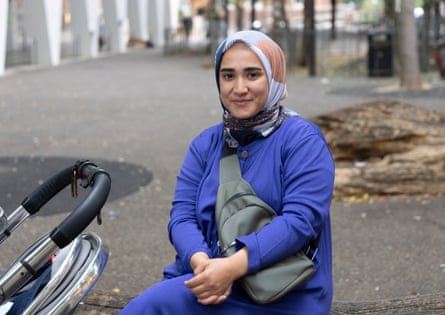 Rana Maybeci sitting near a pram
