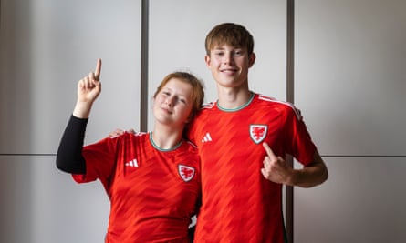 Catrin and Rhys Webb wearing red Wales shirts
