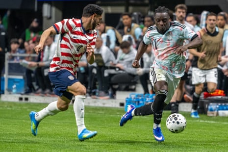 Jeremy Doku #11 of Belgium battles Cristian Roldan #4 of the United States during the second half of the match at Mercedes-Benz Stadium on March 28, 2026 in Atlanta, Georgia. Belgium won the match 5-2.