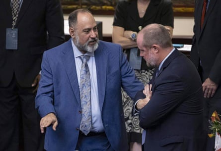 two men speaks pinch each other