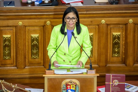 a woman speaking into a microphone