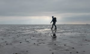 man walking on mud, Foulness, Essex