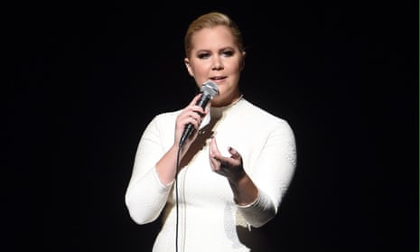 Amy Schumer with mic during an evening with Jerry Seinfeld and Amy Schumer