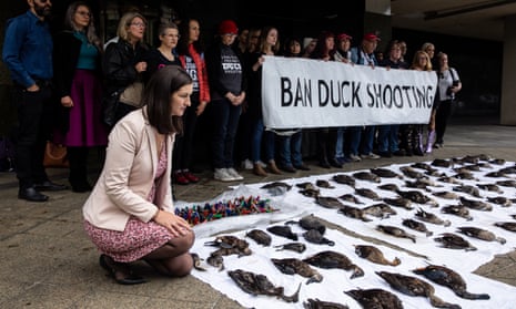Members of Parliament and animal rights activists pose for a photograph during a protest opposing the opening of duck hunting season in Melbourne, Tuesday, May 2, 2023. 