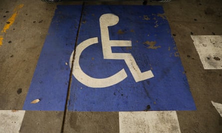 A disabled parking logo on the floor of a carpark