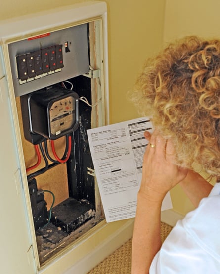 Woman reads her electricity meter