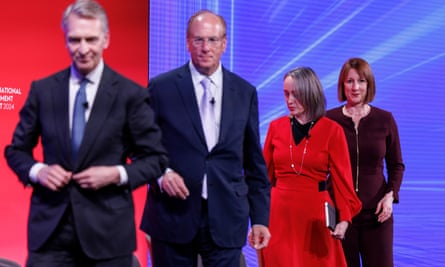 Bruce Flatt, Larry Fink, Carol Young and Rachel Reeves walk on stage for a panel discussion