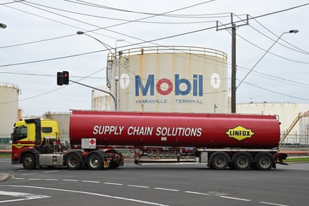A truck transporting petroleum with the words 'supply chain solutions' passes the ExxonMobil Yarraville terminal in Melbourne.