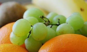 A bunch of grapes and oranges