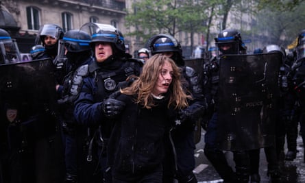 Police arresting a protester in Paris.