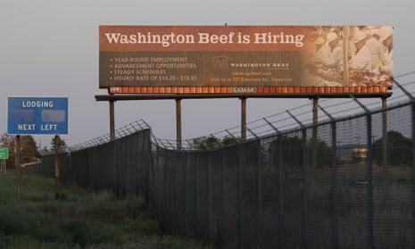A billboard advertises job hiring at Agri Beef’s plant in Toppenish, Washington. Donald Trump last month declared such plants to be critical to the US economy.