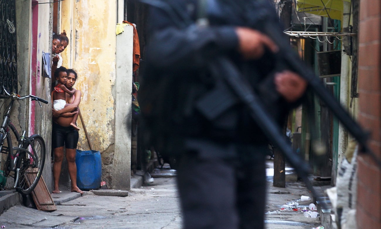 Military police patrol the streets of the Maré favela in Rio de Janeiro.