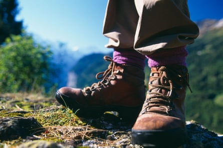 A walker’s feet in close up on a mountain