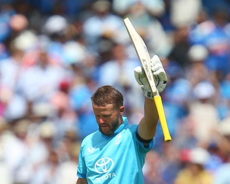 Ben Duckett raises his bat in celebration to the crowd after scoring a century