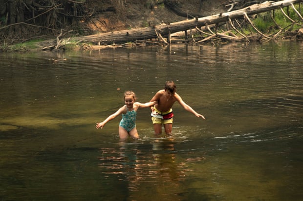 Mark and Victoria, ages 12 and 7, take a swim.