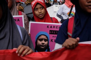School girls hold posters in Jakarta, Indonesia.