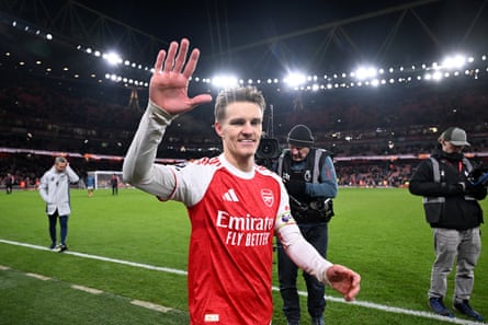 Martin Ødegaard salutes the Arsenal fans after the 4-1 win over Aston Villa extended their lead at the top of the Premier League.