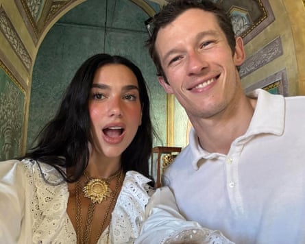 Dua Lipa and Callum Turner in a cathedral