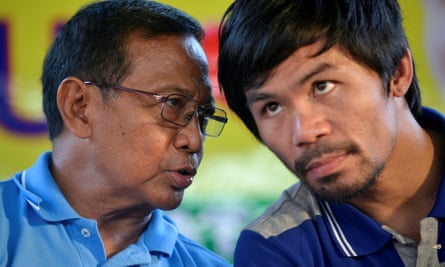 Presidential candidate Jejomar Binay, left, talks to boxer Manny Pacquiao during an election campaign stop in Dasmarinas.