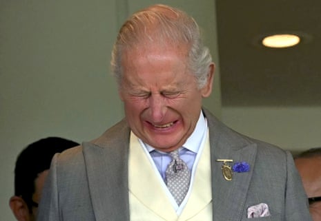 Britain's King Charles III reacts as he watches the runners and riders compete in the Ascot Stakes.