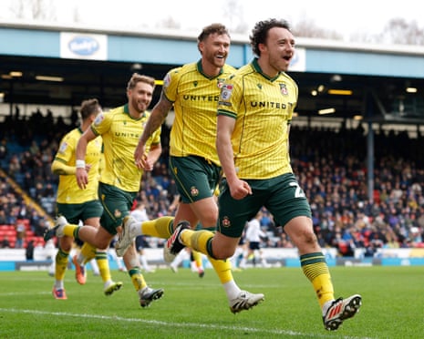 Ollie Rathbone celebrates his stunner for Wrexham.