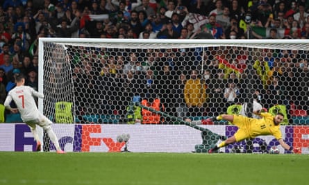 Gianluigi Donnarumma saves Álvaro Morata’s spot kick in the penalty shootout.