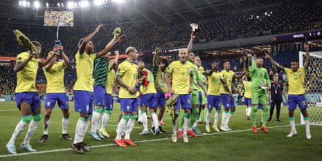 The Brazilian players celebrate at full-time.