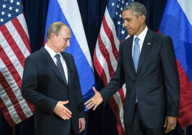 Frosty ... Barack Obama attempts to shake hands with Vladimir Putin