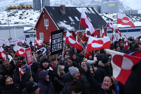Protesters bear Greenlandic flags as they gather in front of the US consulate in Nuuk, Greenland.