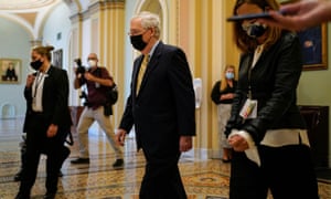 Mitch McConnell walks from the Senate chamber in Washington DC Thursday.