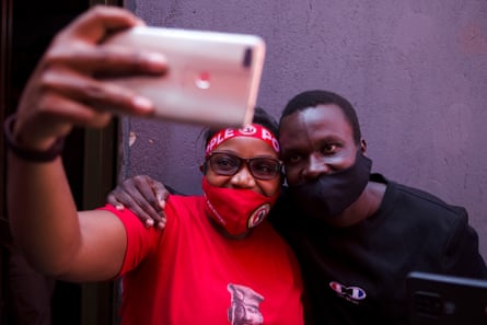 A woman take a selfie with Daniel Brenny Oyerwot after his release from detention.
