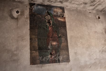 A burnt religious portrait on an internal wall