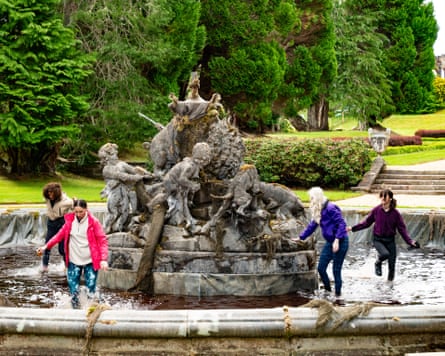 Roxy, Rachel, Ellie and Jade in the shallows of a fountain