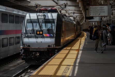 A New Jersey Transit train pulls into a station.