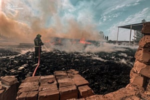 A firefighter extinguishes flames