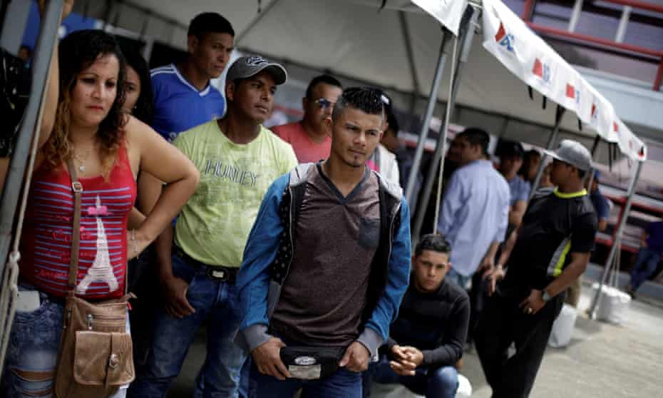 Nicaraguan migrants fleeing unrest at home wait to request refuge in Costa Rica.