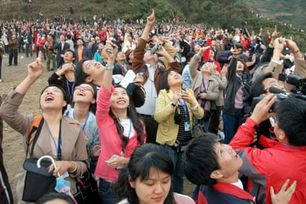 Spectators gather to watch the launch of the Chang'e One lunar orbiter in 2007.