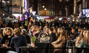 A last night of socialising in 2020 as new restrictions were about to be enforced on gatherings at restaurants and bars in Soho, London.