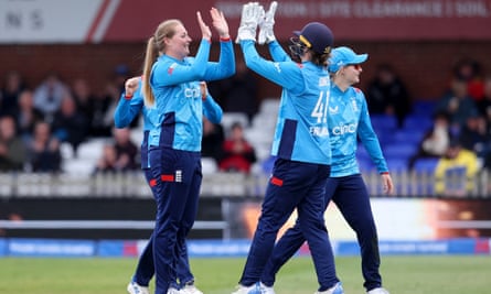 Sophie Ecclestone celebrates with Amy Jones after dismissing Pakistan's Sadaf Shamas.
